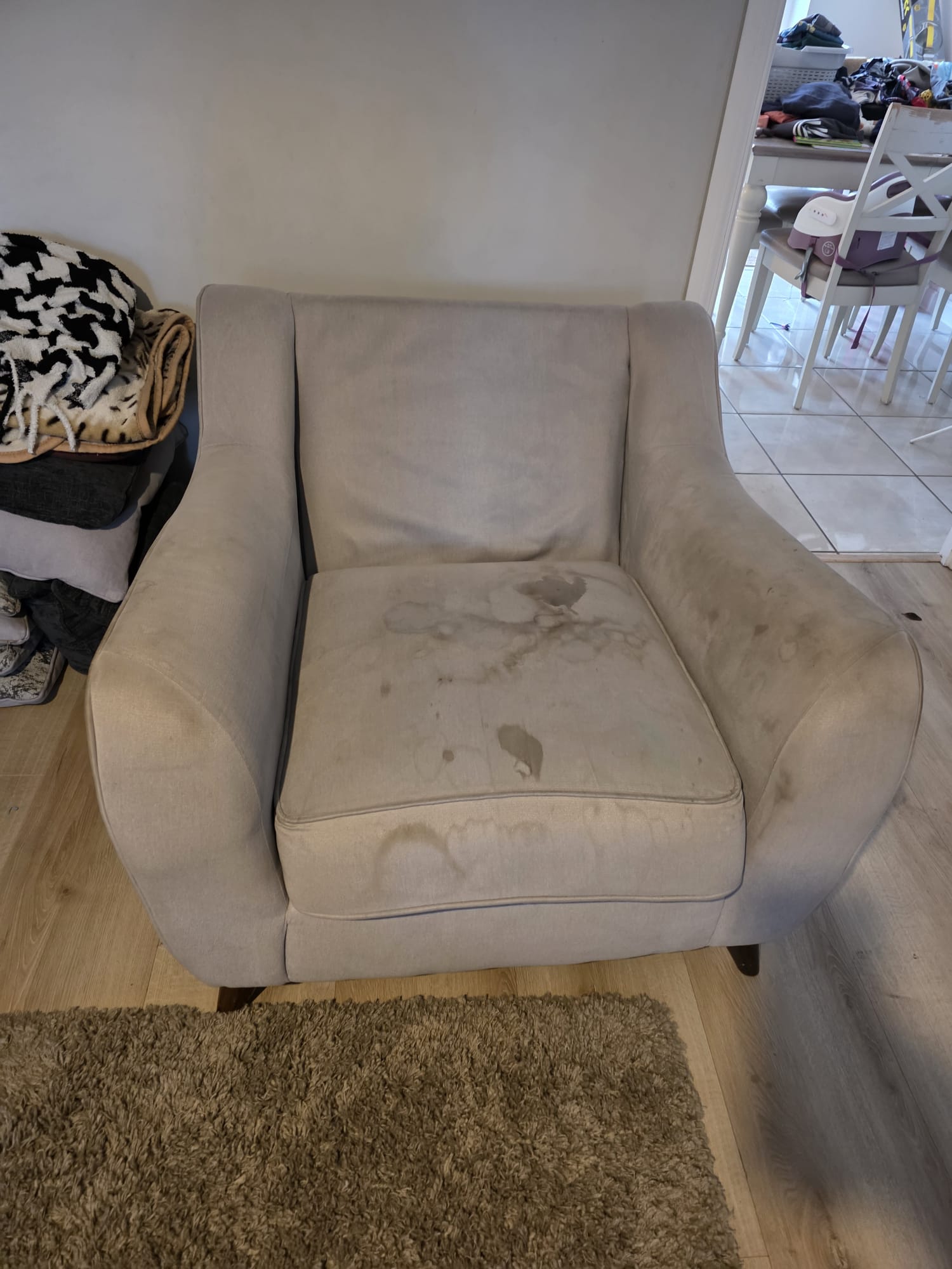 Stained armchair before professional upholstery cleaning in Aylesbury